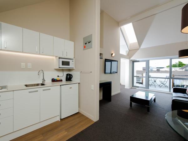 Belmont Motor Inn : photo 6 de la chambre suite 1 chambre lit king-size avec baignoire spa