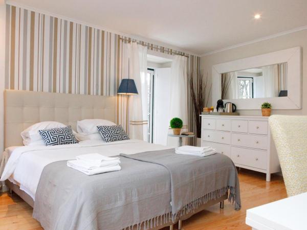 Flores Guest House : photo 1 de la chambre chambre double ou lits jumeaux - vue sur jardin