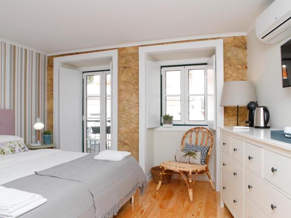 Flores Guest House : photo 2 de la chambre chambre double ou lits jumeaux - vue sur jardin