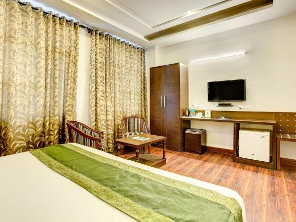 Treebo C T International : photo 4 de la chambre chambre deluxe double ou lits jumeaux