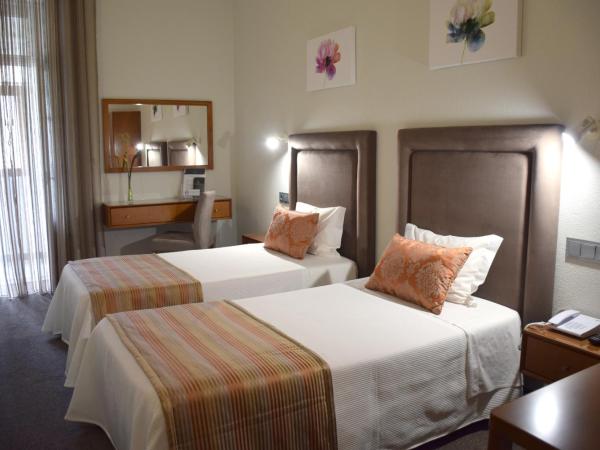 Lusitana Hotel : photo 3 de la chambre chambre lits jumeaux