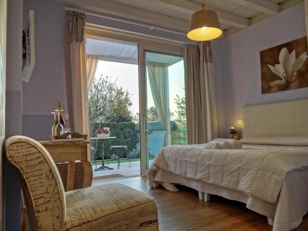 B&B La Magia dei Sogni Relais : photo 7 de la chambre chambre double supérieure avec lit d'appoint - vue sur jardin