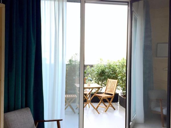 Talo Urban Rooms : photo 1 de la chambre chambre triple avec terrasse