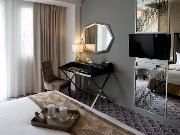 Aston Bellevue Radio Dalam : photo 3 de la chambre chambre lit king-size deluxe