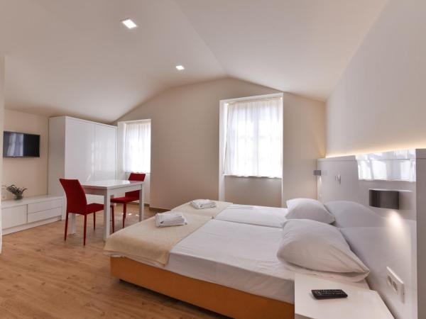 Idassa Atrium rooms : photo 1 de la chambre chambre double ou lits jumeaux avec balcon
