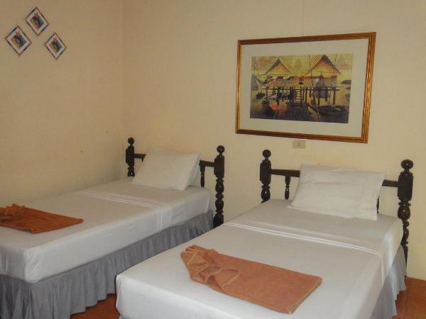 Tropical Garden Bungalow : photo 7 de la chambre hébergement lits jumeaux avec climatisation - vue sur jardin