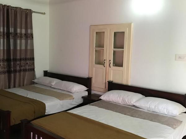 Palm Rivera Kochi : photo 3 de la chambre chambre deluxe double ou lits jumeaux