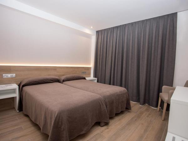 Hotel Perla : photo 1 de la chambre chambre lits jumeaux
