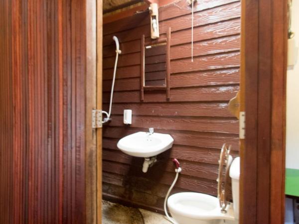 Tropical Garden Bungalow : photo 2 de la chambre bungalow avec lits jumeaux et ventilateur