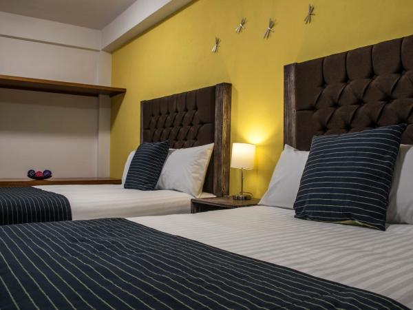 Hotel Casa Aurora : photo 1 de la chambre chambre avec 2 grands lits queen-size