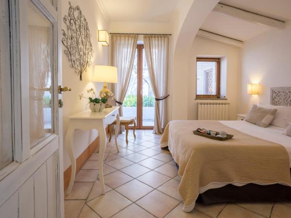 Tenuta Del Poggio Antico : photo 4 de la chambre suite supérieure avec jardin privé