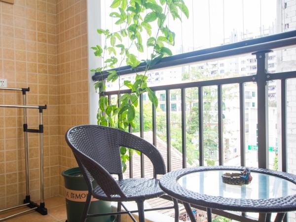 Sanya Passion fruit Inn : photo 9 de la chambre chambre lit queen-size avec balcon