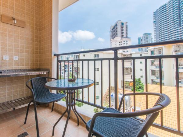 Sanya Passion fruit Inn : photo 10 de la chambre chambre lit queen-size avec balcon