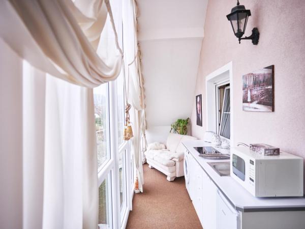 Bluestars Apartments : photo 1 de la chambre appartement - vue sur jardin