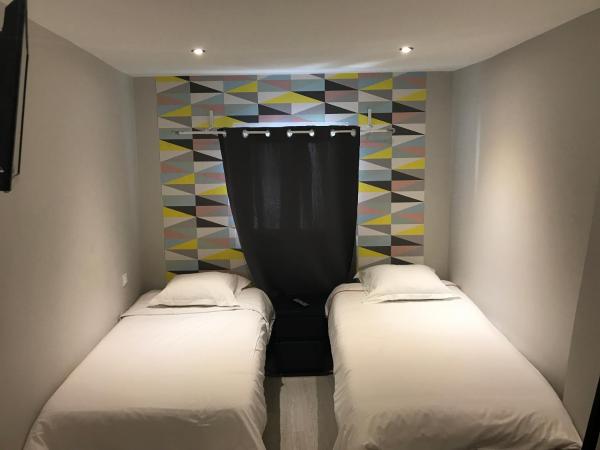 Hôtel Beauséjour : photo 1 de la chambre chambre lits jumeaux