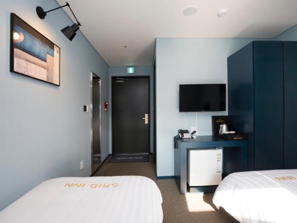 Grid Inn Hotel : photo 2 de la chambre chambre lits jumeaux