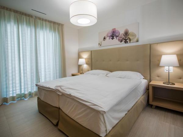 Delta Resort Apartments : photo 2 de la chambre appartement avec accès au spa - vue sur jardin