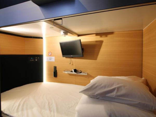 Sejour Inn Capsule : photo 2 de la chambre hébergement capsule lits jumeaux privé