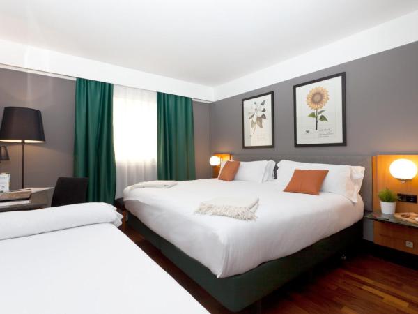 Hotel Malcom and Barret : photo 6 de la chambre chambre triple