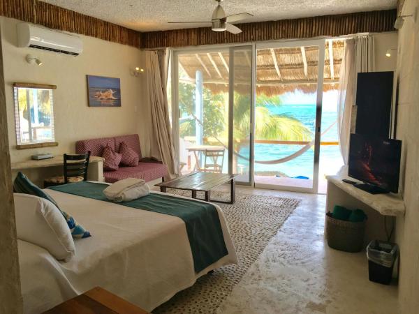 Maria's Kan Kin : photo 1 de la chambre chambre lit king-size - vue sur océan