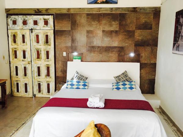 Maria's Kan Kin : photo 4 de la chambre chambre lit king-size - vue sur océan