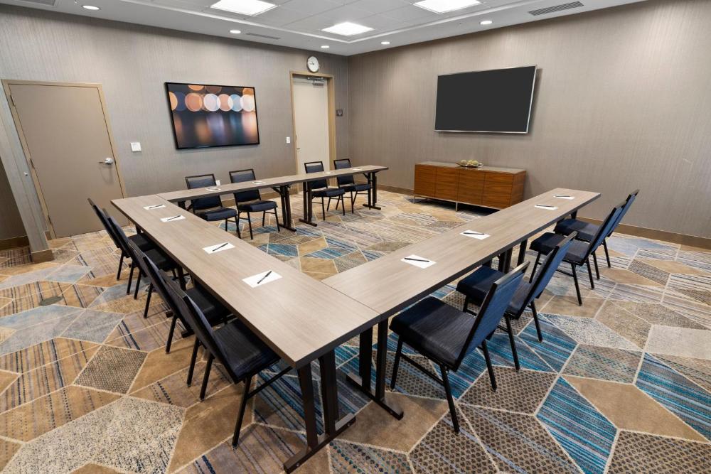 Conference room with U-shaped tables, chairs, and a display at Fairfield Inn & Suites San Jose North/Silicon Valley
