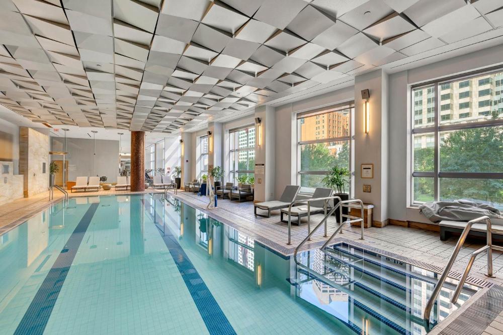 Indoor pool with loungers and large windows at InterContinental Boston