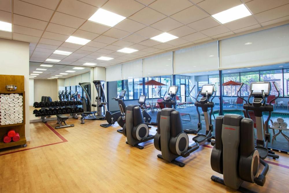 Fitness room with cardio machines and free weights at Sheraton Lincoln Harbor Hotel