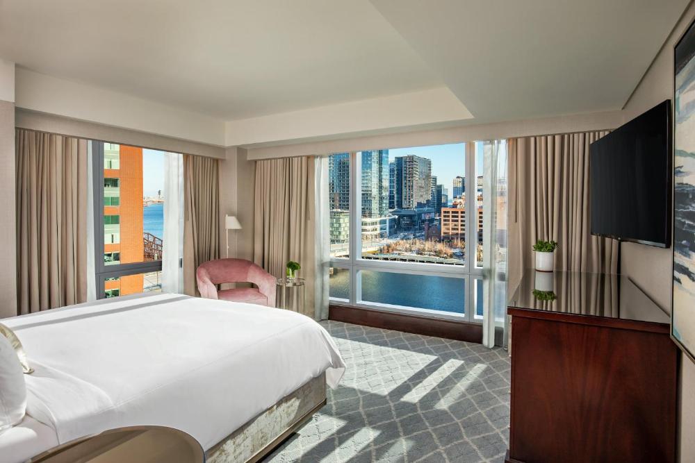 Guest room with a bed and large window at InterContinental Boston