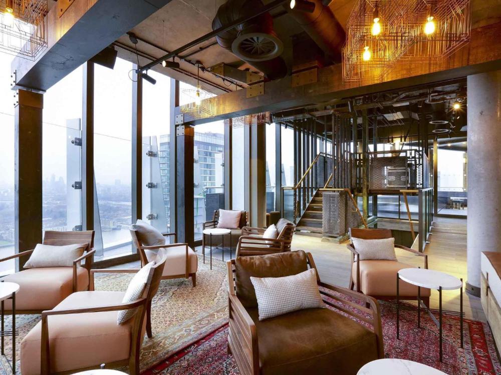Lobby with couches and chairs at Novotel London Canary Wharf