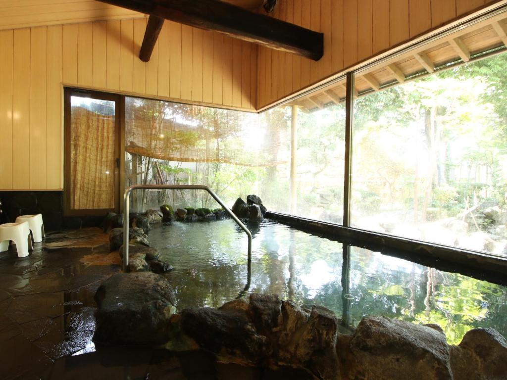 Chambre avec Piscine d'Eau dans un Bâtiment dans l'établissement Suehirokan, à Tagami