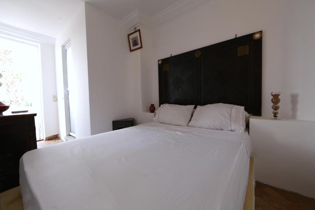Un ou plusieurs lits dans un hébergement de l'établissement Riad Elli Marrakech