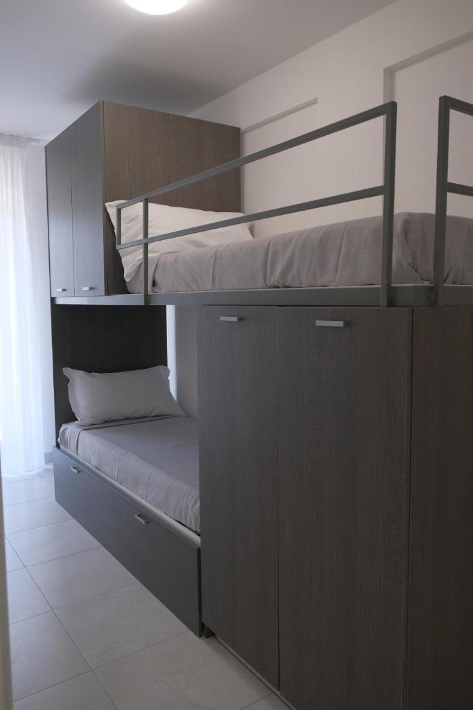 Ce lit superposé se trouve dans un dortoir doté de 2 lits superposés. dans l'établissement I GIARDINI DI ZEUS, à Métaponte