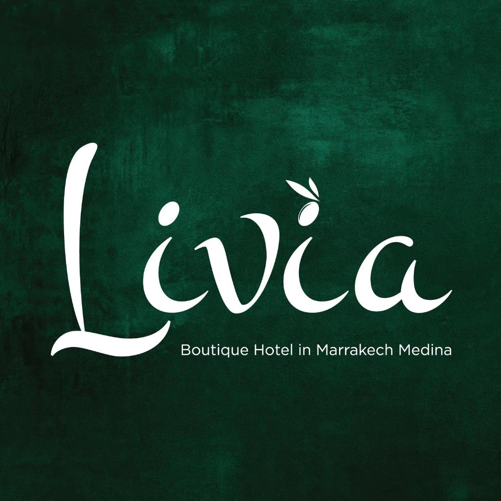 un logo pour un hôpital de Marrakech dans l'établissement Riad Livia Marrakech - Adults Only, à Marrakech