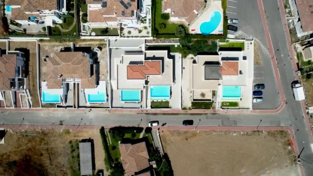 une vue aérienne d'un bâtiment dans l'établissement Villa con piscina privata BudoniAffitti, à Budoni