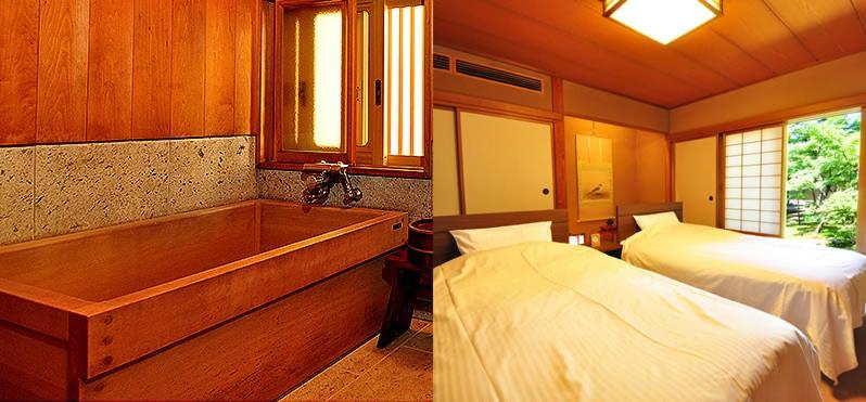 - une chambre avec une baignoire, un lit et un lit dans l'établissement Ryokan Imai, à Shibata