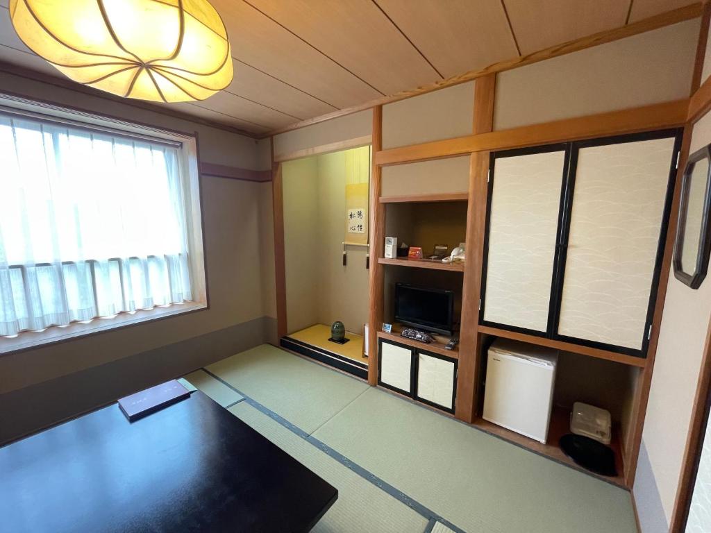 Un ou plusieurs lits dans un hébergement de l'établissement Ryokan Ichinomatsu