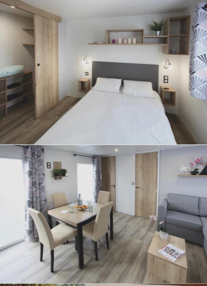 une chambre et un salon avec un lit et une table dans l'établissement Mobilhomme camping, à Fréjus