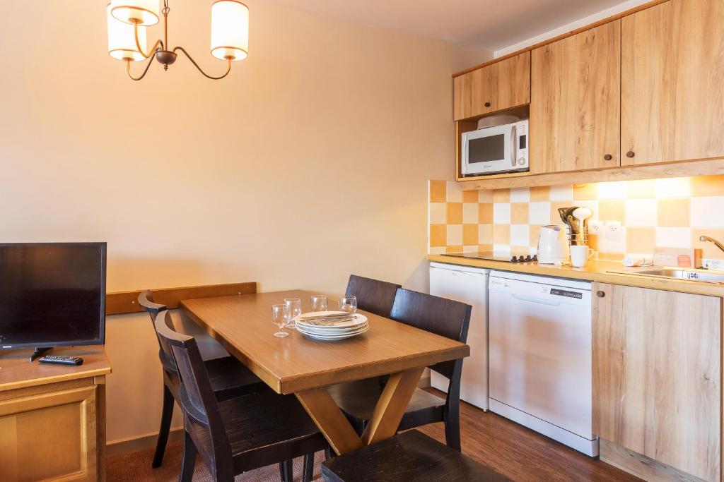 Cuisine ou kitchenette dans l'établissement Résidence Pierre & Vacances l'Albane