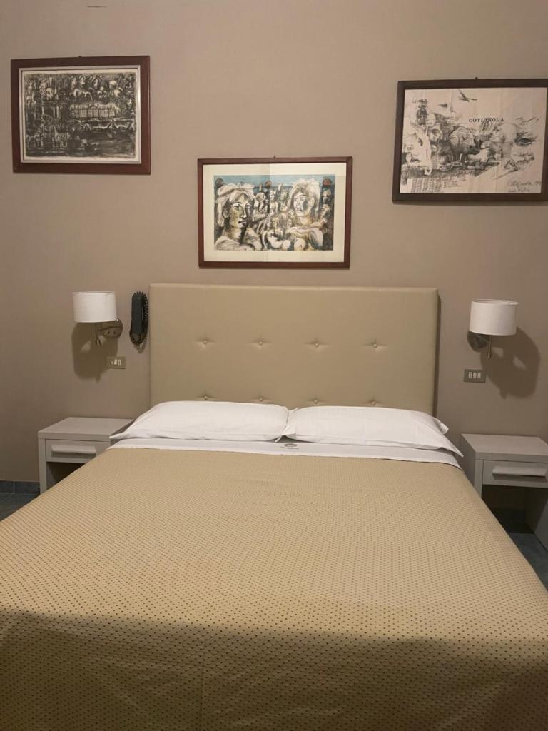 Un ou plusieurs lits dans un hébergement de l'établissement Hotel Ariella