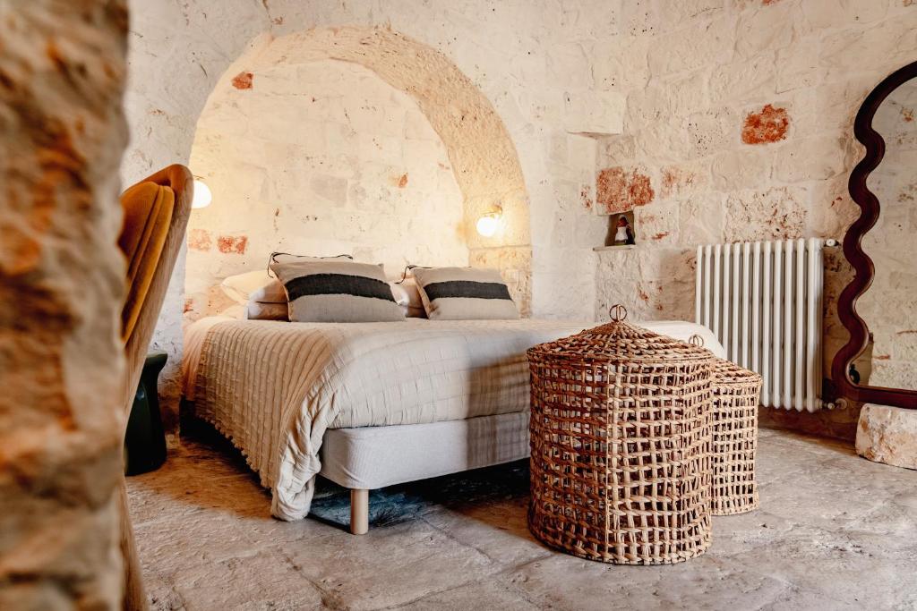 Un ou plusieurs lits dans un hébergement de l'établissement Trullo Zaira