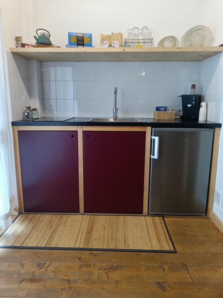 Cuisine ou kitchenette dans l'établissement SUITTINA, exclusive - wellness - living