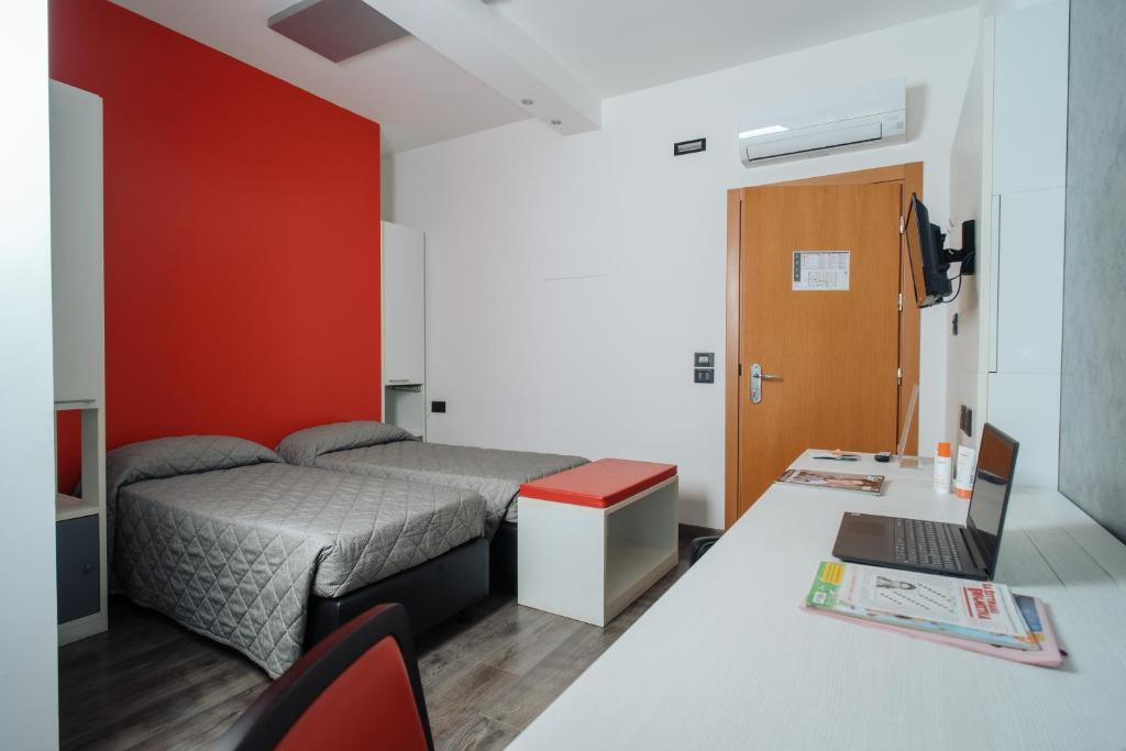 Un ou plusieurs lits dans un hébergement de l'établissement Eden Hotel