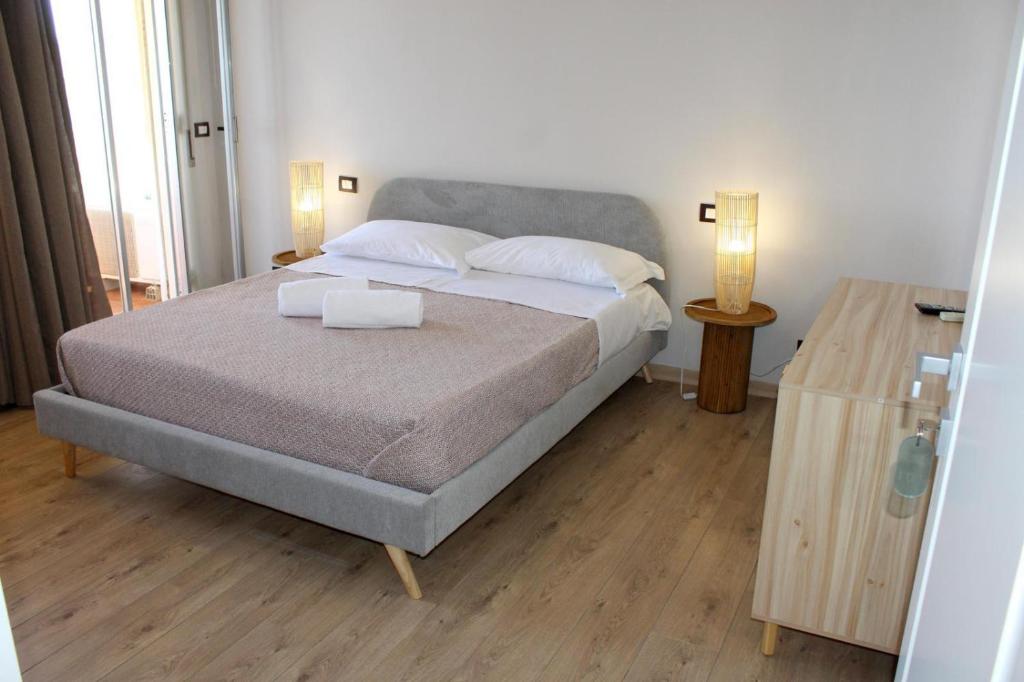 Un ou plusieurs lits dans un hébergement de l'établissement Paguro Beach Hotel