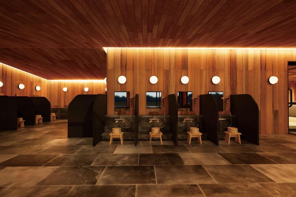 une pièce avec une rangée de chaises et de miroirs dans l'établissement Ooedo Onsen Monogatari Premium Enakyo, à Ena 42 autres photos