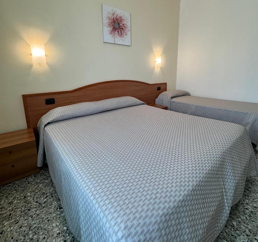 Un ou plusieurs lits dans un hébergement de l'établissement Hotel Valente