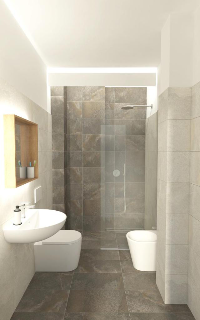 une salle de bain avec un lavabo, des toilettes et une douche dans l'établissement Hotel La Pergola Dependance, à Lignano Sabbiadoro