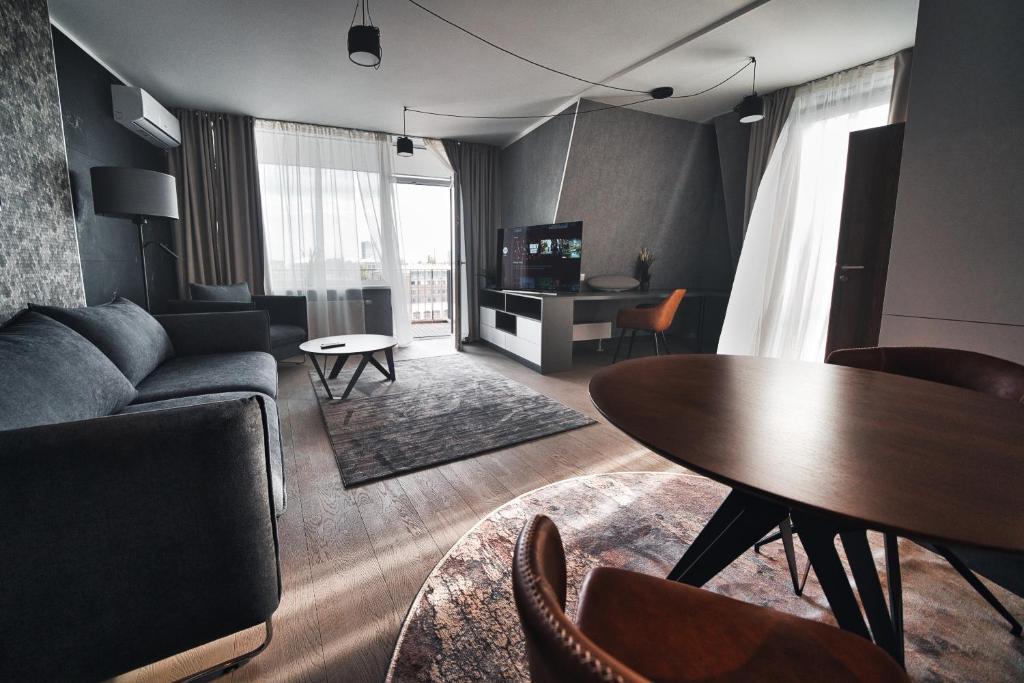 Modern central Riga apartment with balcony, gym access, dedicated parking, kitchen & AC 2