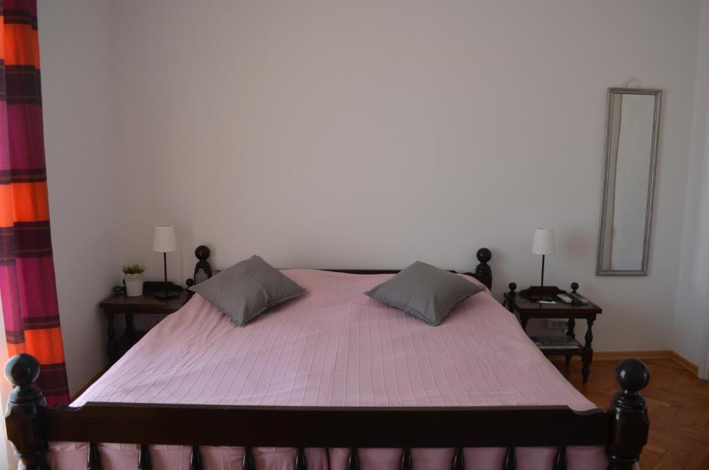 Postel nebo postele na pokoji v ubytování Apartments Mili