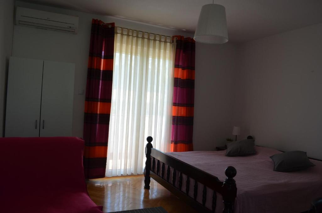 Postel nebo postele na pokoji v ubytování Apartments Mili